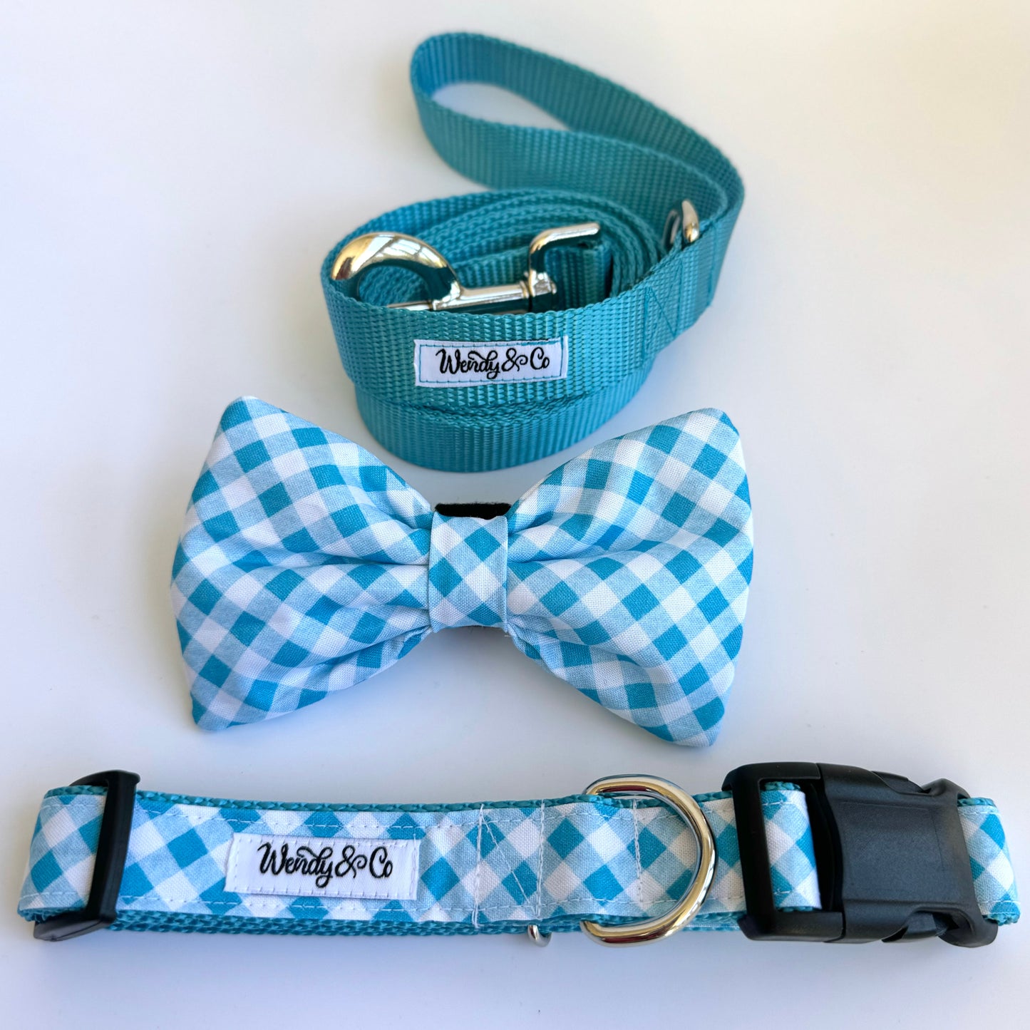 Blue plaid collar, bow tie and leash.