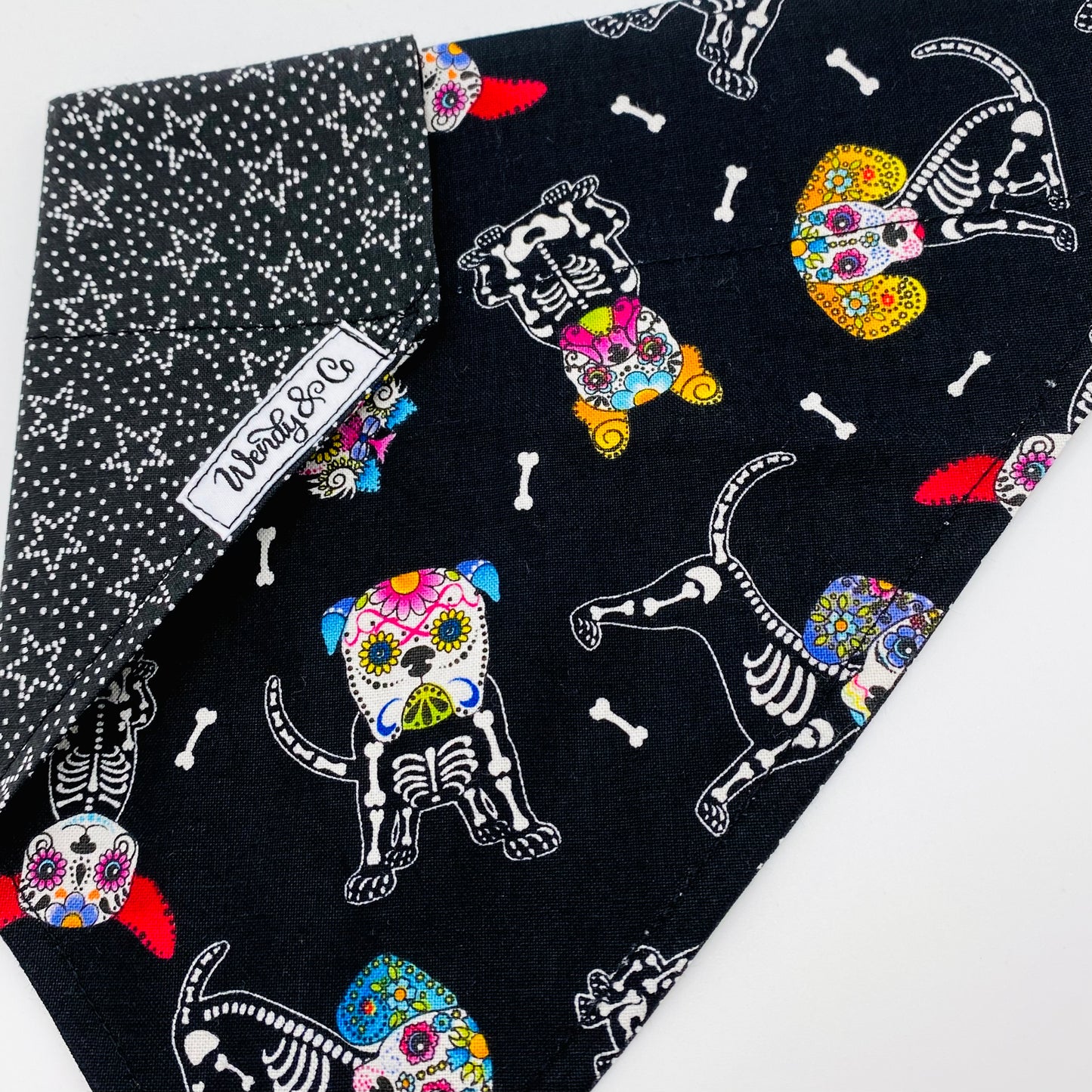 Over the collar dog bandana with skull candy dogs for Halloween.