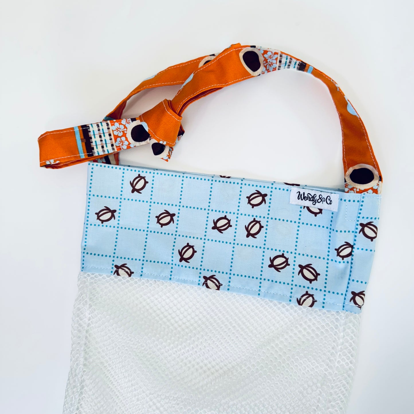 Crossbody seashell bag with turtles.