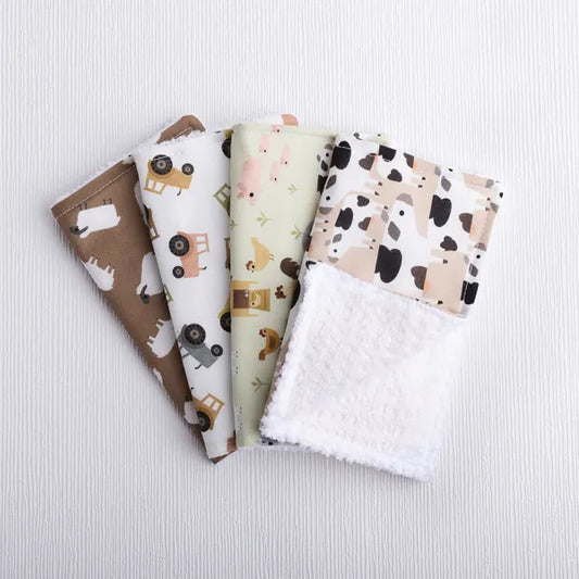 Sustainable washing cloths in homestead print with cows, sheep, tractors.