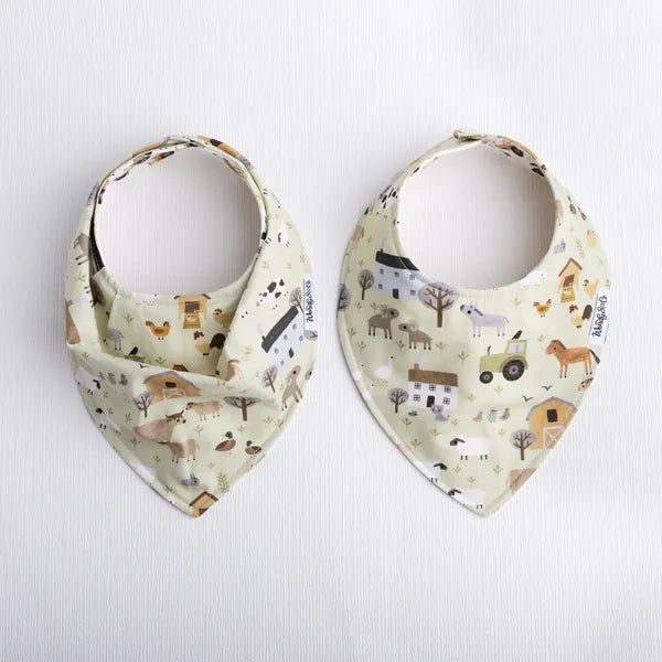 Reversible baby bib in homestead farm print.