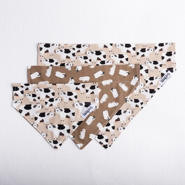 Reversible over the collar dog bandana in cow and sheep print.