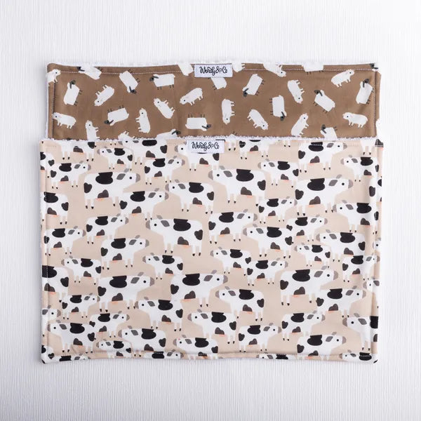 Absorbent burp cloths in cow and sheep print.