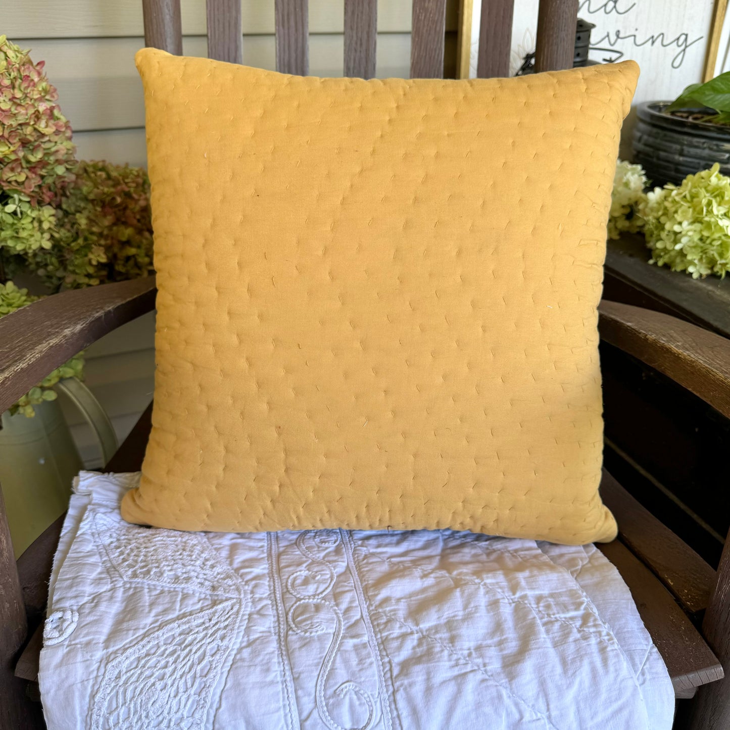 Mustard yellow pillow back.