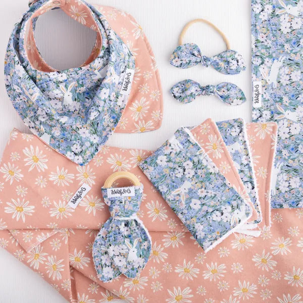 Petal & Hare collection featuring baby bib, burp cloth, teether, washcloth, hairbow, and dog bandana in bunny and floral print.