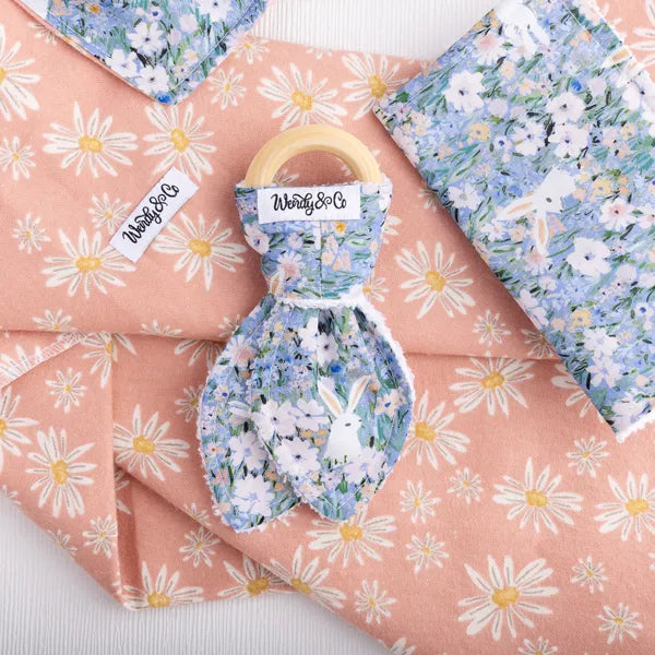 Baby collection with wooden teether with bunny and floral print.