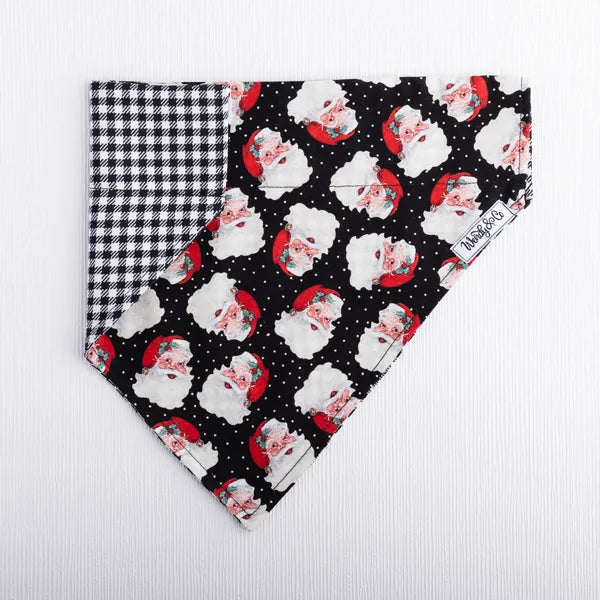 Dog bandana featuring Christmas Santa print and classic houndstooth reverse.