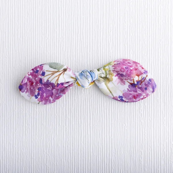 Buttercup bow featuring soft floral design.