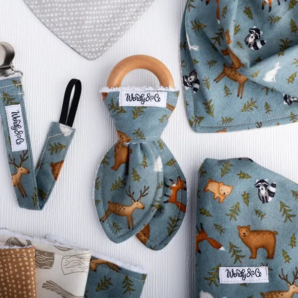 Whispering Woods baby teether with soft woodland fabric.