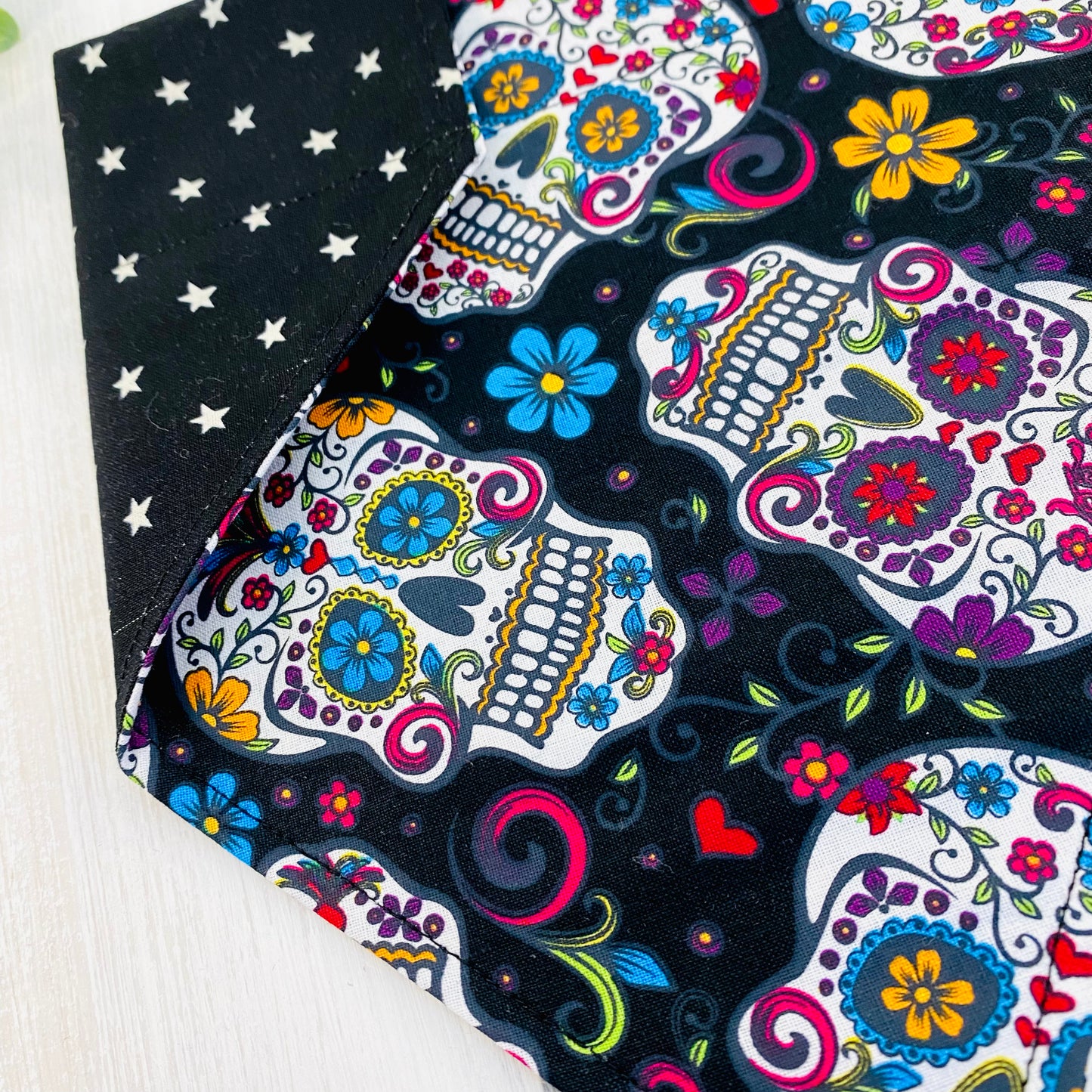 Skull candy dog bandana close-up of black bandana.