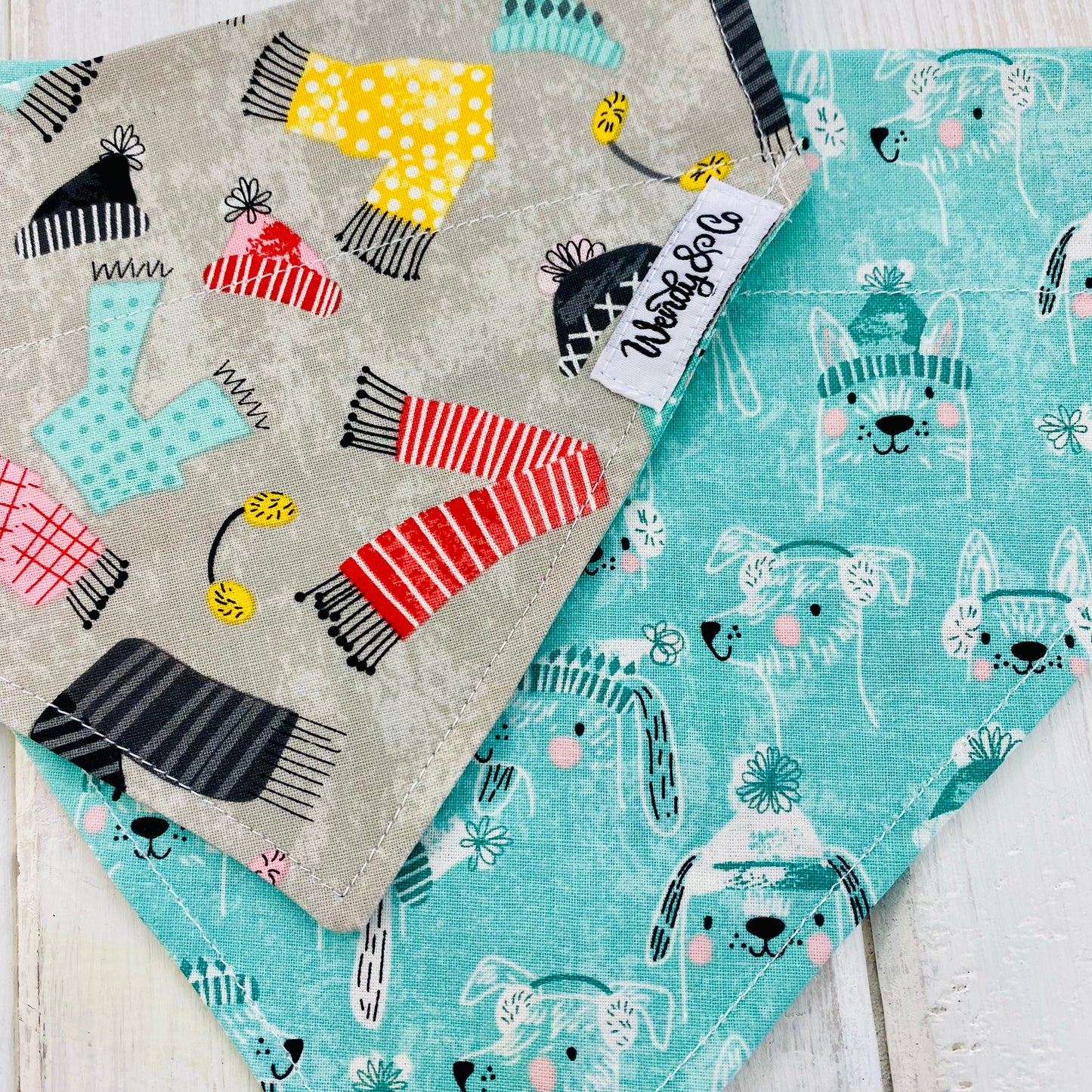 Reversible dog bandana for extra small dogs up to extra large dogs in mint green with winter clad dogs.