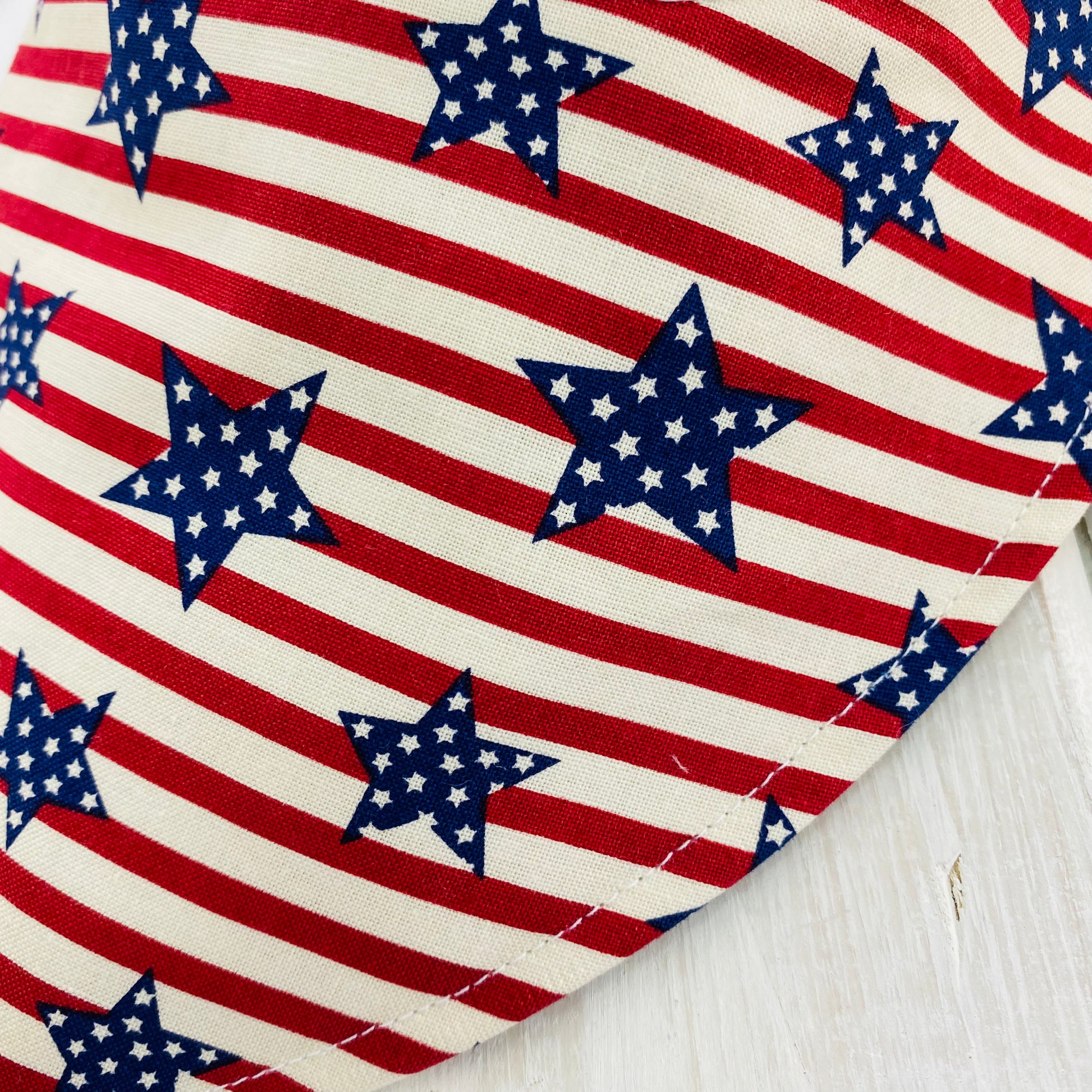 Close up of red and cream stripe with navy stars.