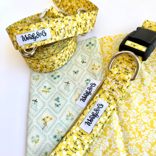 Buttercup yellow and floral dog bandana that slides over the collar.