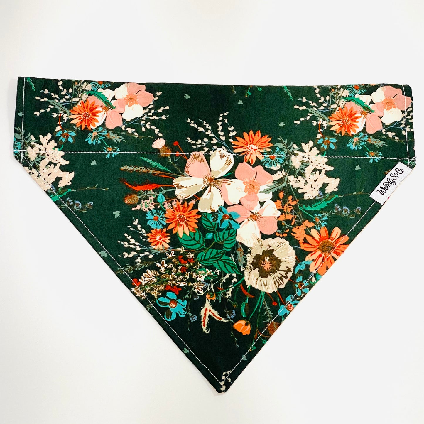 Gorgeous reversible dog bandana with emerald green background and a bouquet of blush flowers.