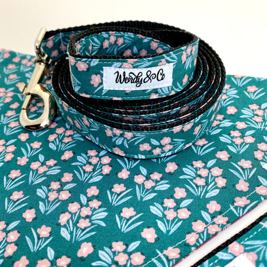 Floral blooms in pink, mint and teal on a reversible dog bandana.
