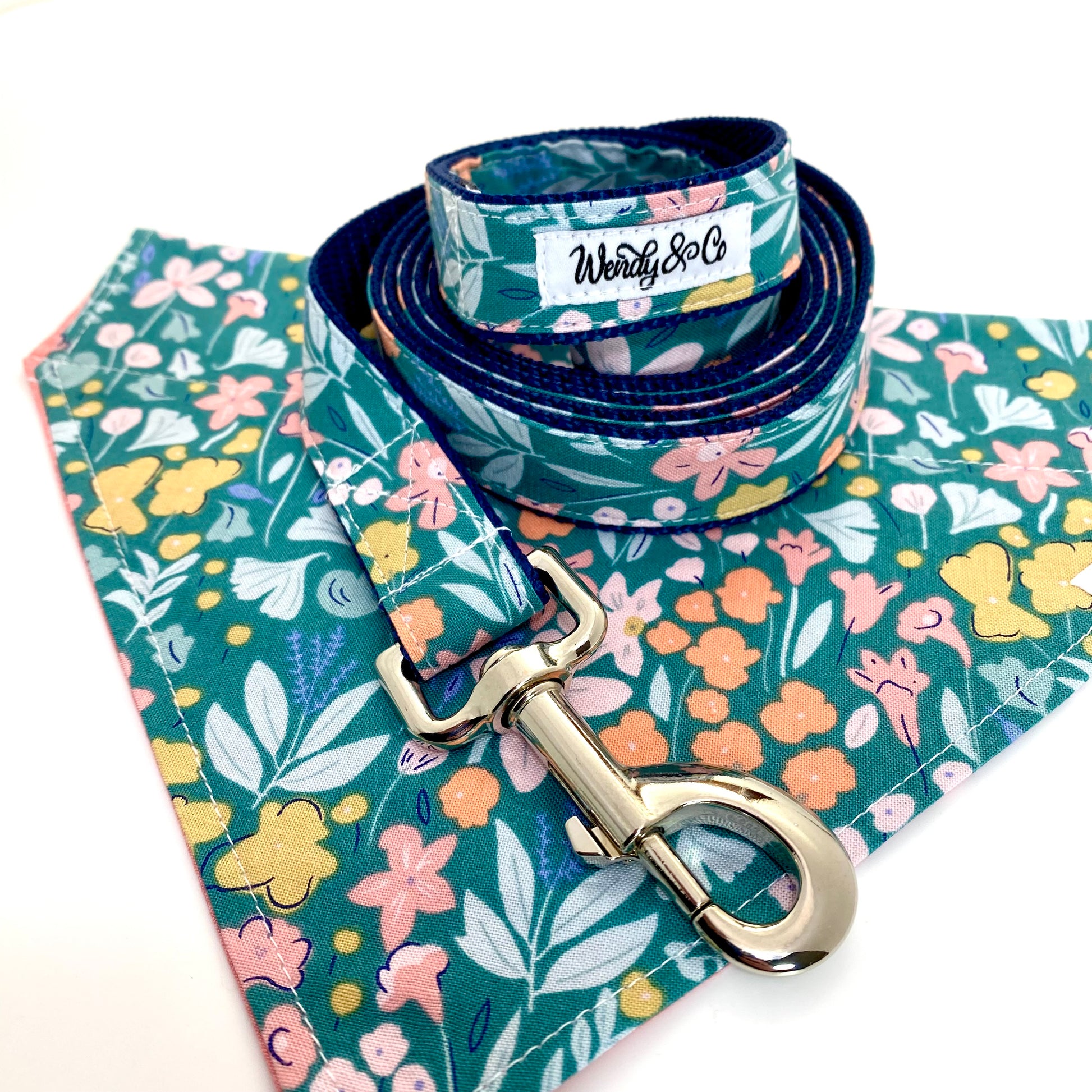 Pastel floral dog bandana that’s reversible and slides over the collar with matching leash.