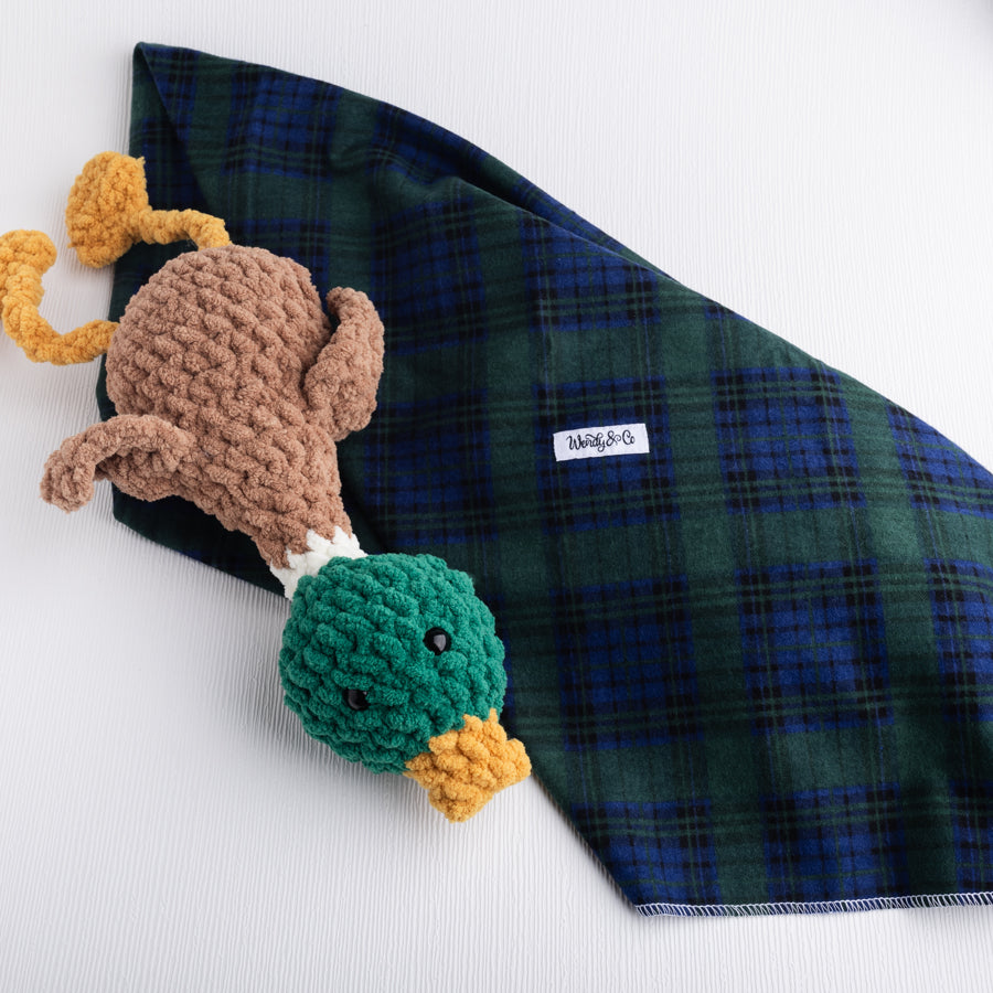 Green and navy plaid flannel baby blanket with crochet mallard duck.