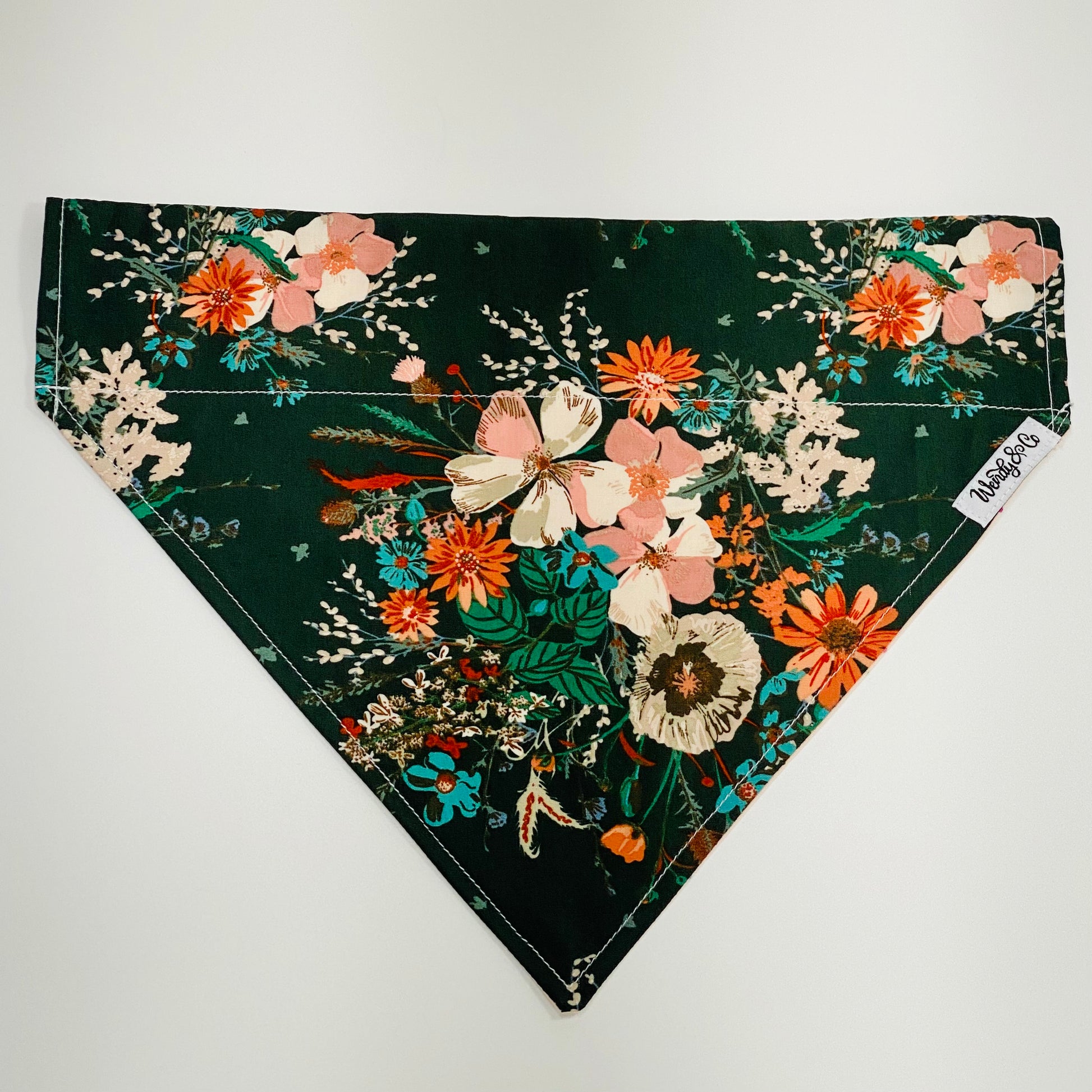 Over the collar dog bandana in emerald green with wildflowers.