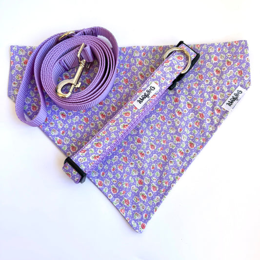 Lilac reversible dog banana that slides over the collar. Shown with leash, collar, and bandana.