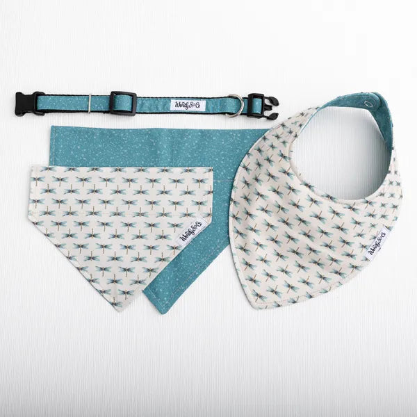 A pet accessory set including a teal and white patterned collar, a matching teal bandana, and a dragonfly bib with a teal pattern, laid out on a white background.
