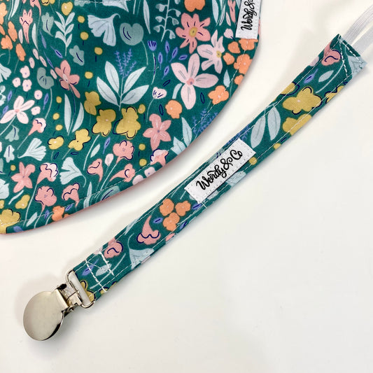 Pastel floral with pale yellow, pink, mint and peach- pacifier clip.