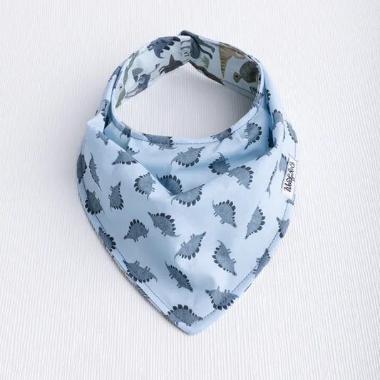 Dinosaur Dream baby bib with triceratops and other dinos.