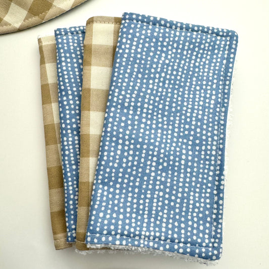 S.e. of 4 washing cloths for baby in sandstone check and blue design.