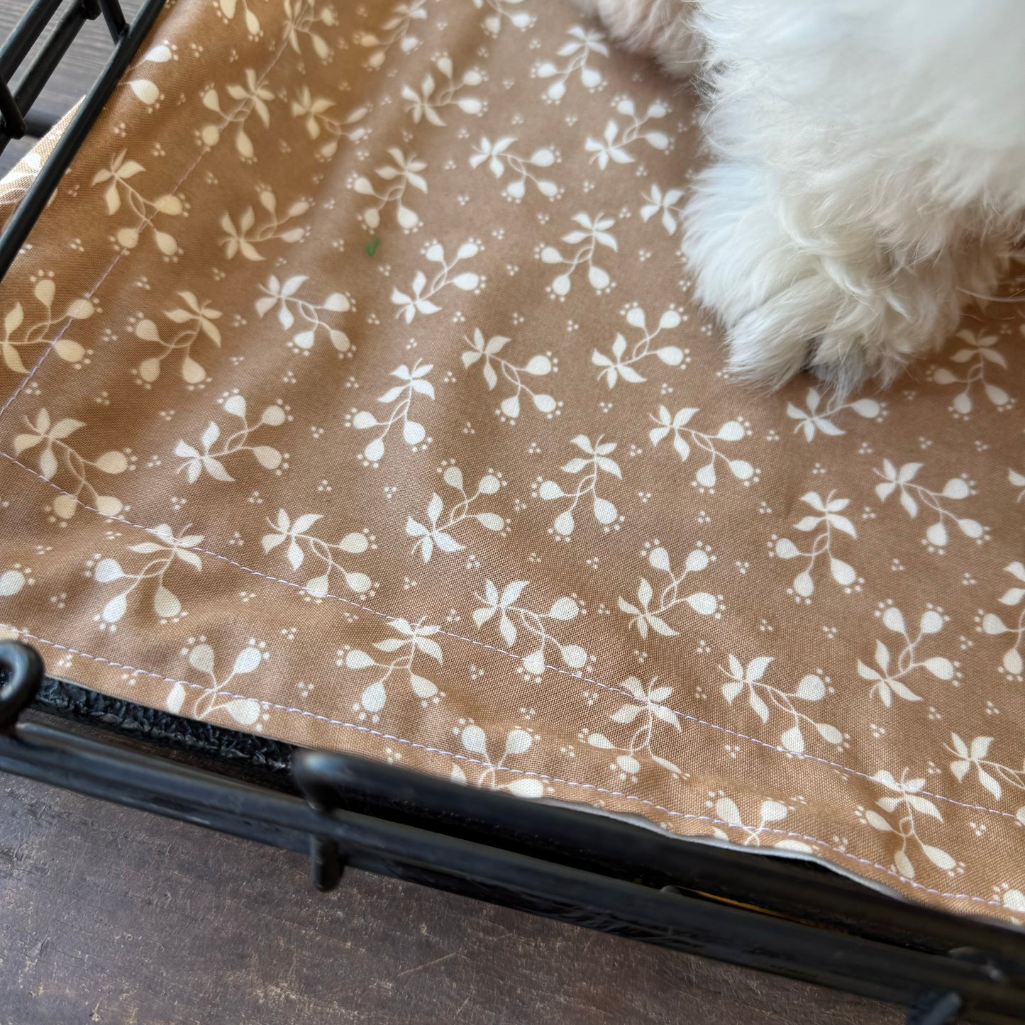 Tan floral waterproof crate mat.