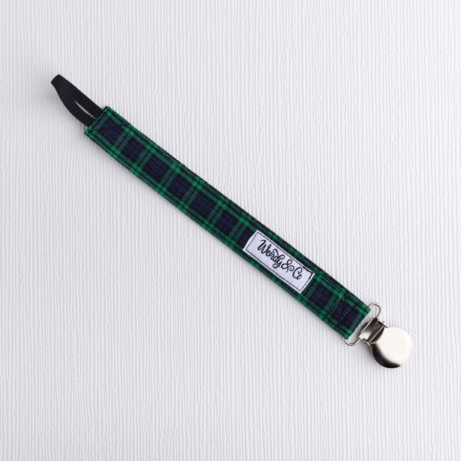 Navy and green plaid pacifier clip.