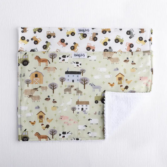 Burp cloth for baby in farm scene and tractor print.