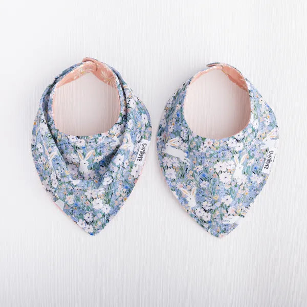 Reversible bandana bibs in floral blue background.