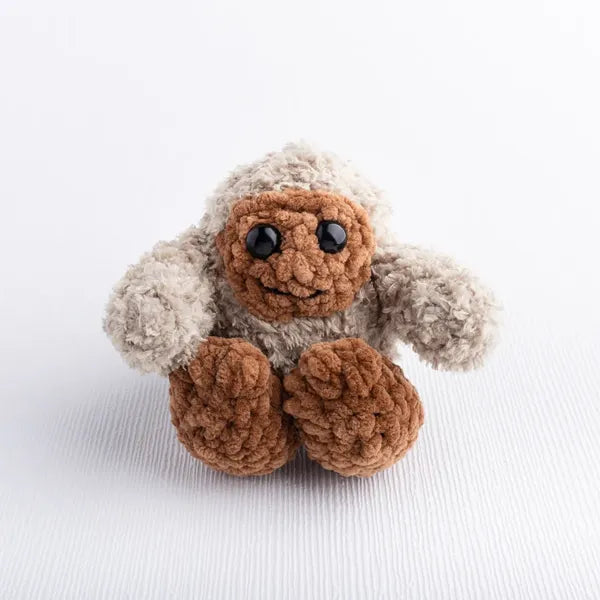 Crochet Bigfoot toy in soft crochet yarn, part of Under the Stars baby gift set.