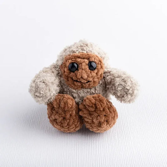Crochet Bigfoot toy in soft crochet yarn, part of Under the Stars baby gift set.