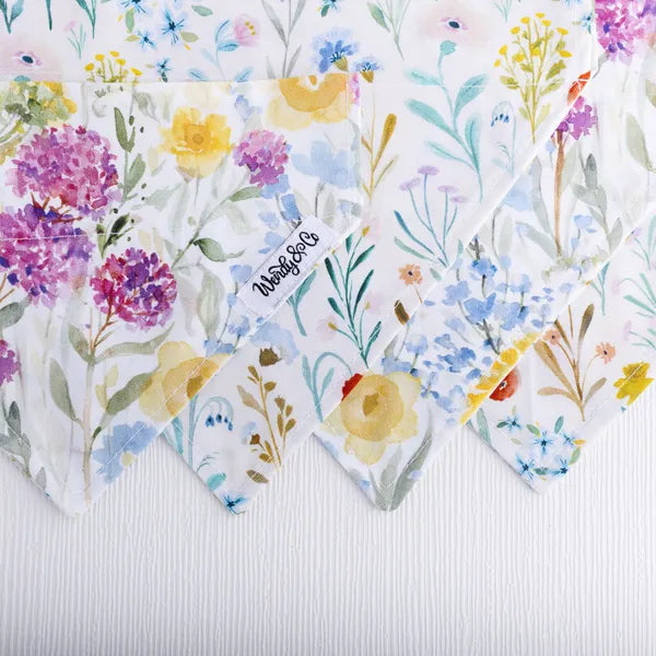 Close up of reversible over the collar dog bandana in soft florals.