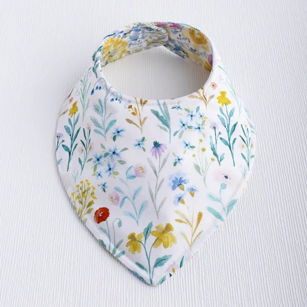 Baby bib with yellow floral fabric from the Buttercup collection.