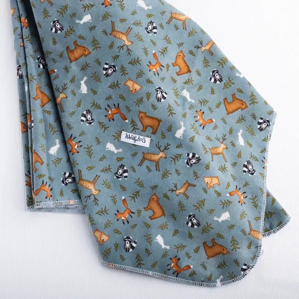 Soft extra large receiving blanket with forest animals on a gray/blue background.