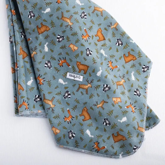 Soft extra large receiving blanket with forest animals on a gray/blue background.
