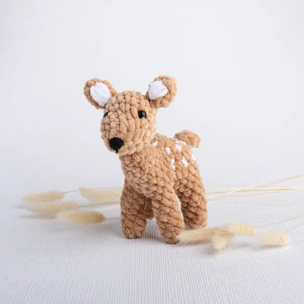 Hand-crocheted deer plush named Fauna from the Whispering Woods collection.