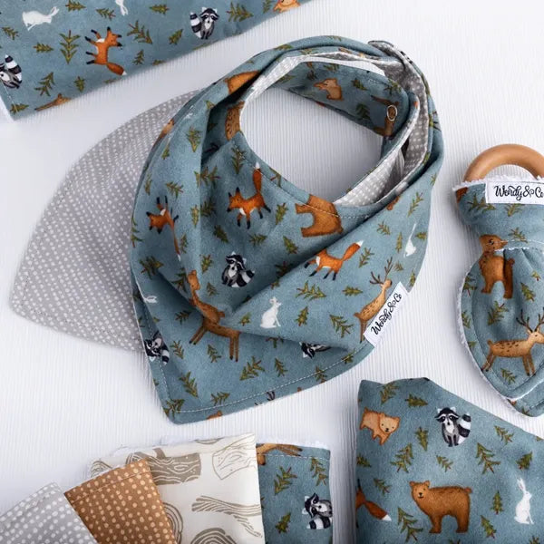 Baby bib with forest-inspired print from the Whispering Woods collection.
