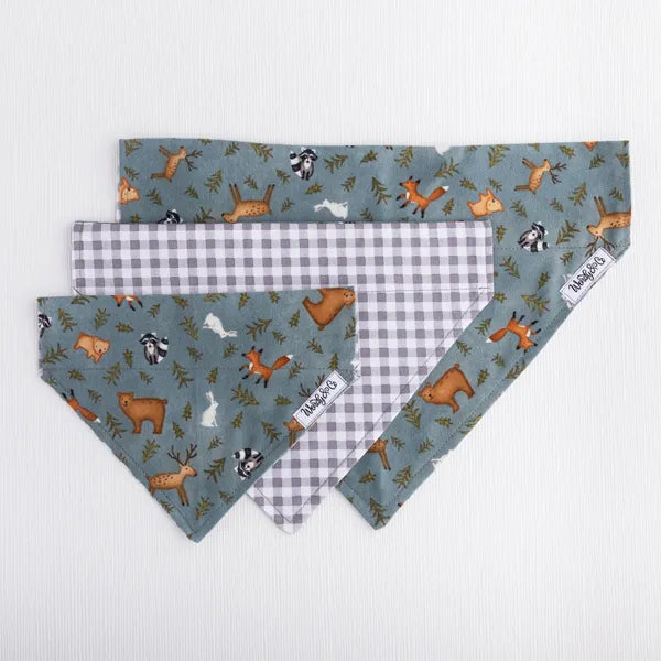 Over the collar Whispering Woods dog bandana with woodland print with gray check reverse.