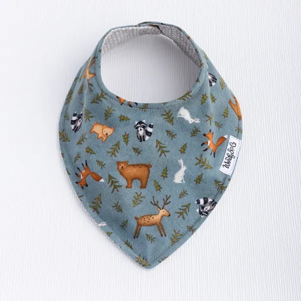 Whispering Woods baby bib featuring woodland pattern in soft earth tones.
