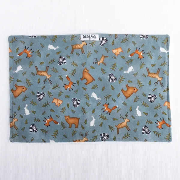 Whispering Woods burp cloth with forest print in natural colors.