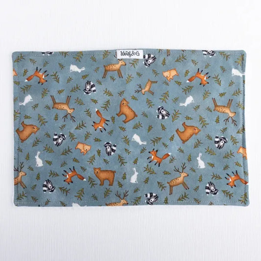 Whispering Woods burp cloth with forest print in natural colors.