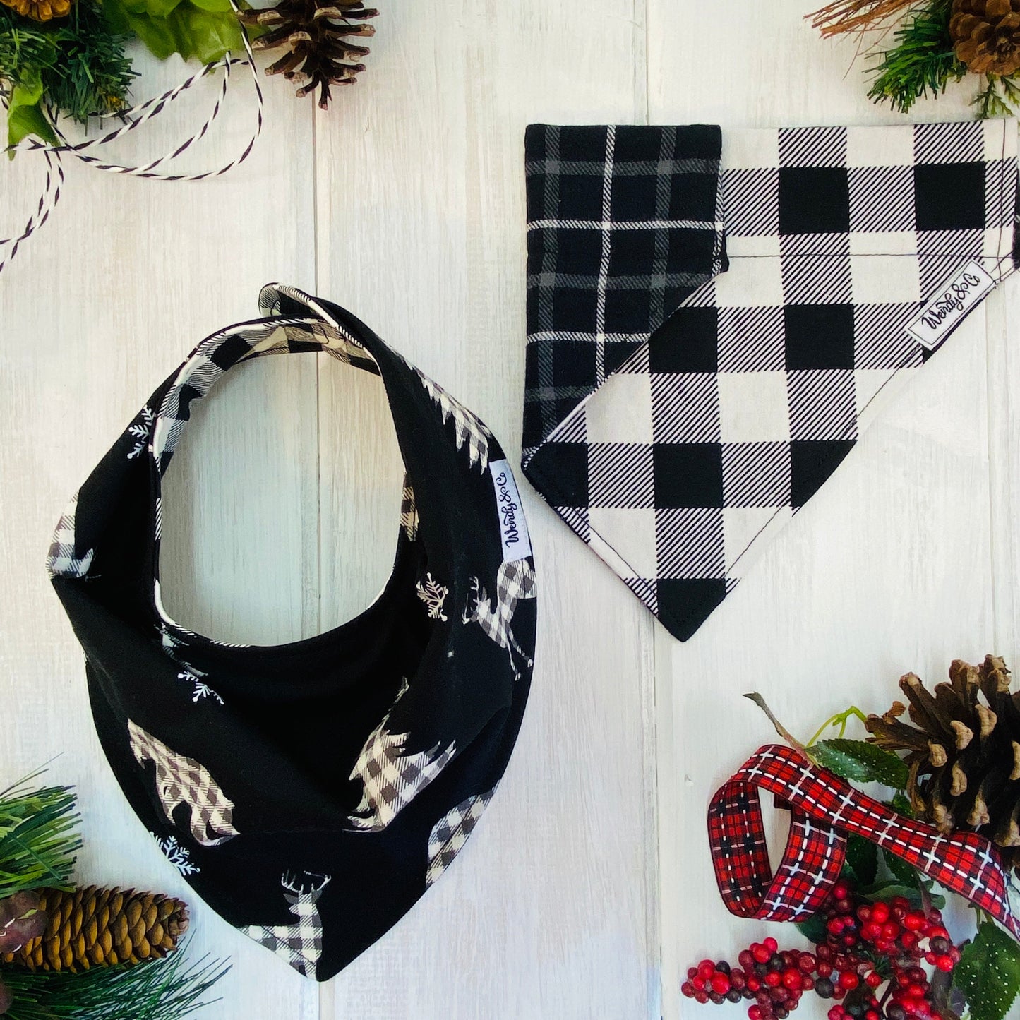 Baby bib and matching pet bandana in black and white buffalo check.