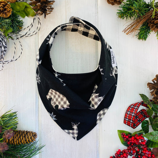 Reversible bandana bib in Black & cream check bears on black background,