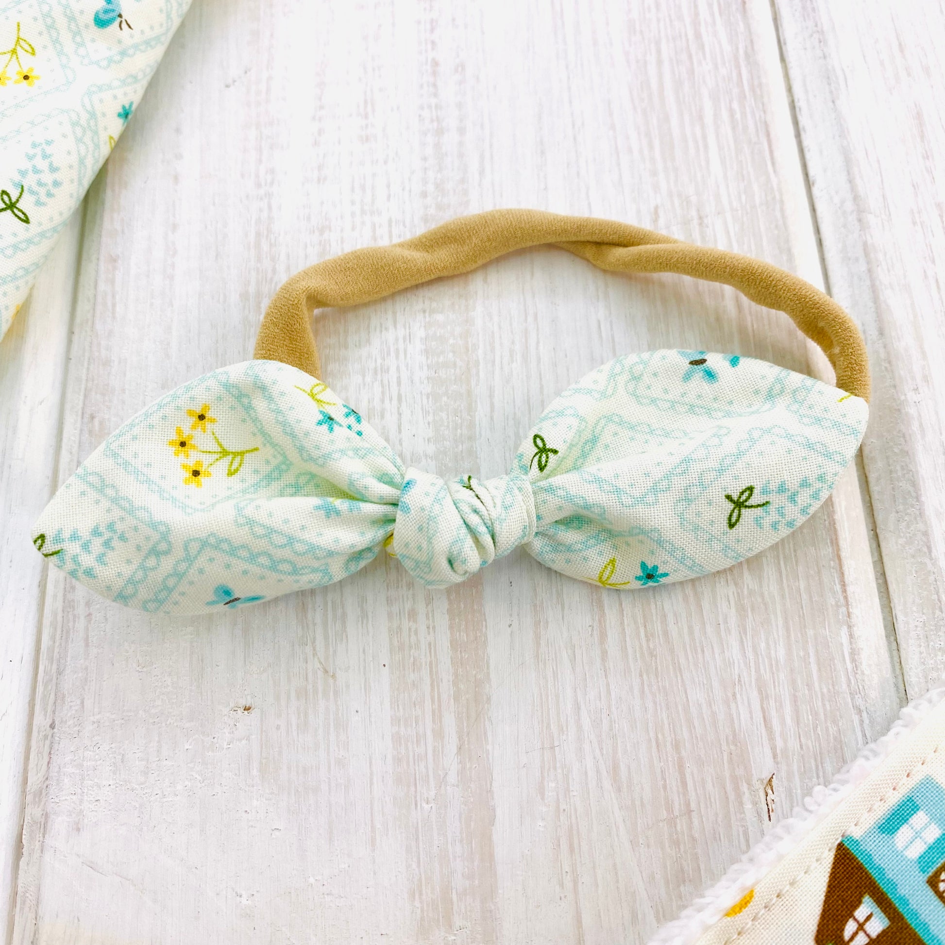 Baby bow headband, blue floral with yellow flowers.