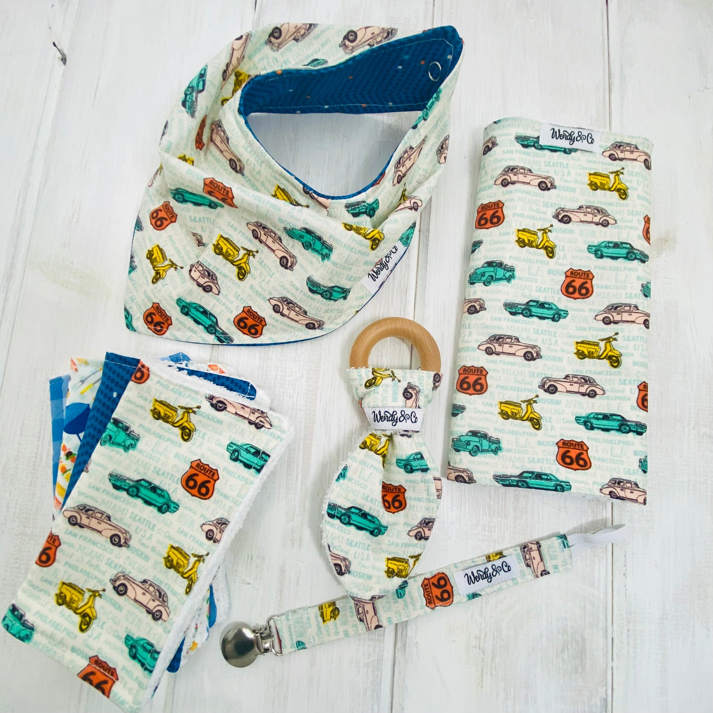 Baby boy gift set including burp cloth, washing cloths, paci clip, teether and reversible bandana bib, in Route 66 fabric.