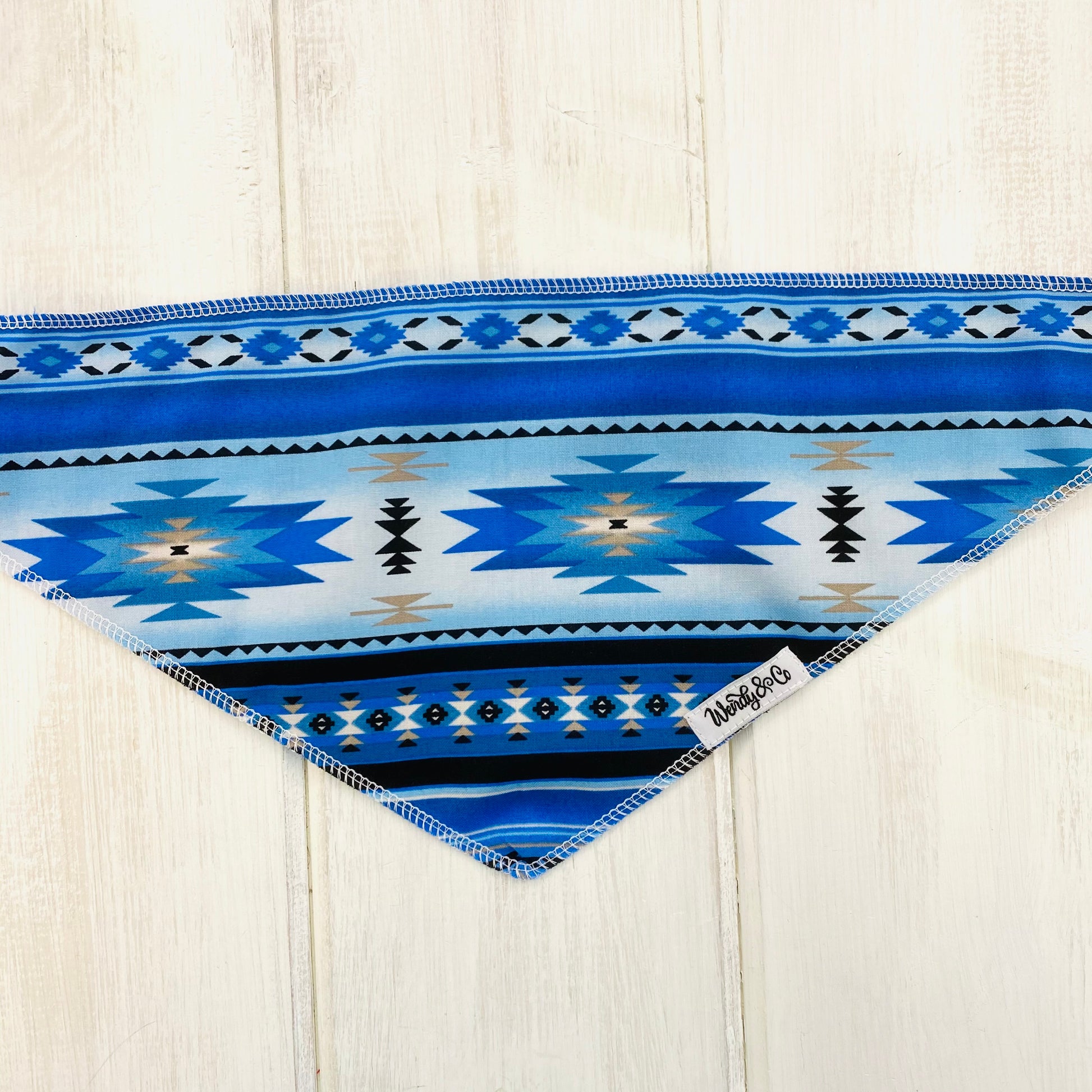Tie on dog bandana in southwest print in shades of blue.