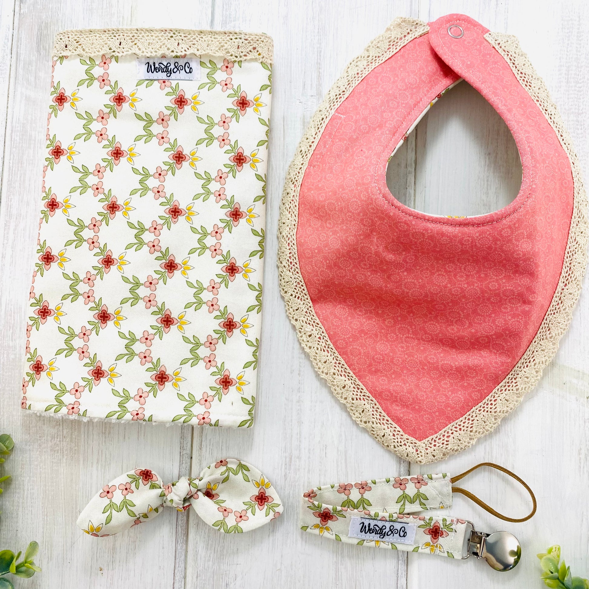 Luxury handmade baby gift set with vintage trim in florals and pinks.