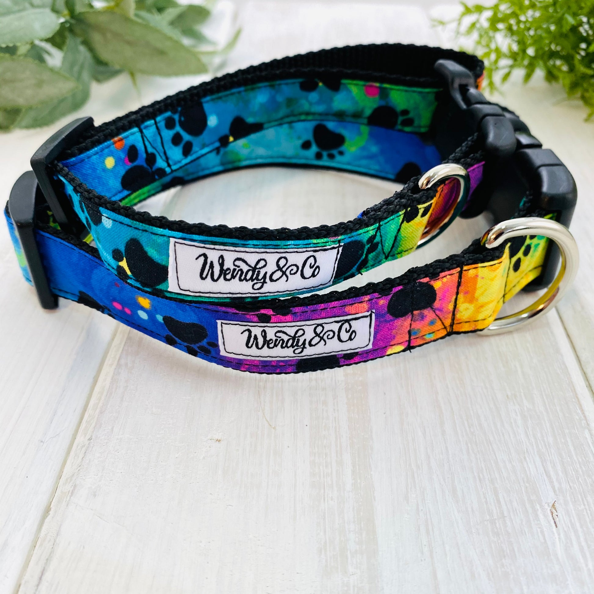Dog collars small and medium in tie dye pattern with black paw prints.